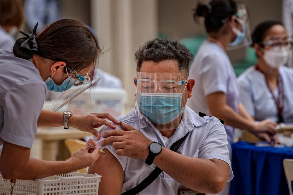 You still have to roll up your sleeve even if it's a mock vaccination drill.