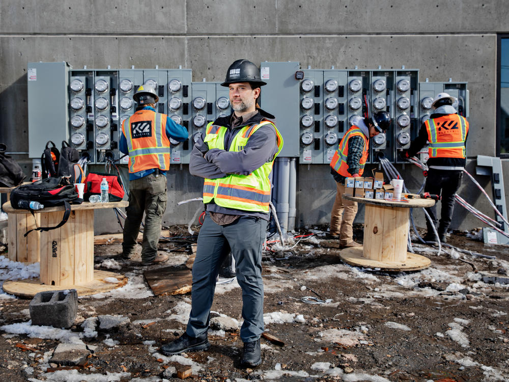 Tyler Hollon, who works for a construction company in Utah, says eliminating natural gas from apartment buildings can reduce costs. Hollon's company now shares its designs and budgets with other builders. 