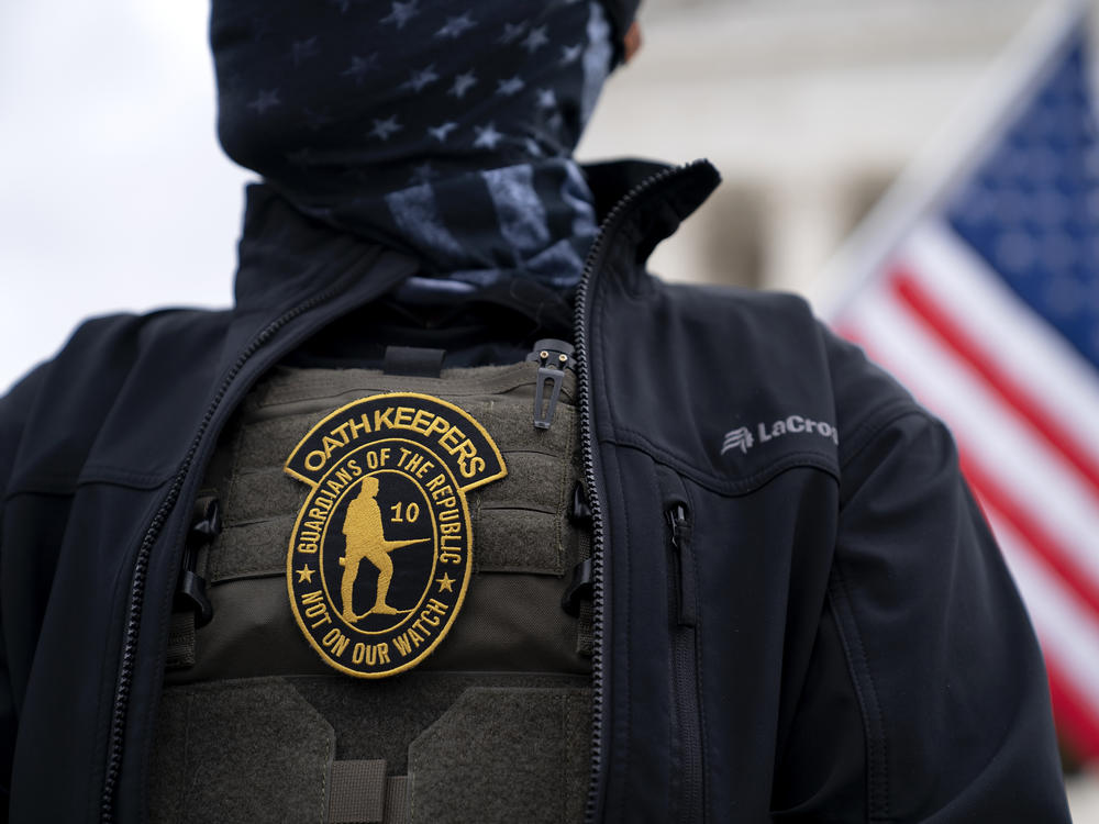 A demonstrator wears an Oath Keepers anti-government organization badge on a tactical vest during a protest outside the Supreme Court in Washington, D.C., on Jan. 5, 2021.
