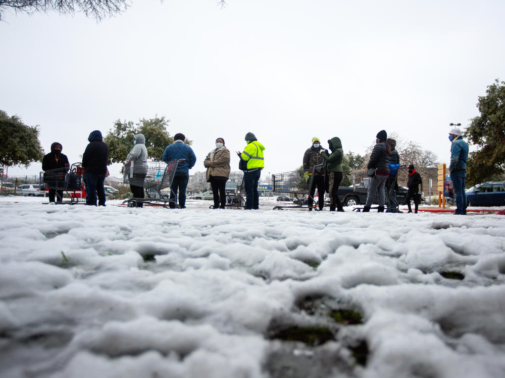 People wait in long lines at an H-E-B grocery store in Austin, Texas, on Wednesday. The  weather disaster is an 