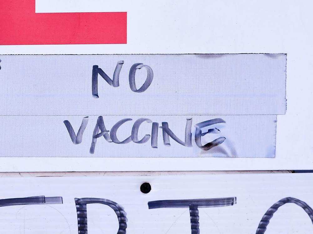 A sign at a vaccination site in Los Angeles reflects the holdup in vaccine distribution as a result of this week's storms. White House officials said Friday that the extreme weather delayed the shipment of some 6 million doses across the country.