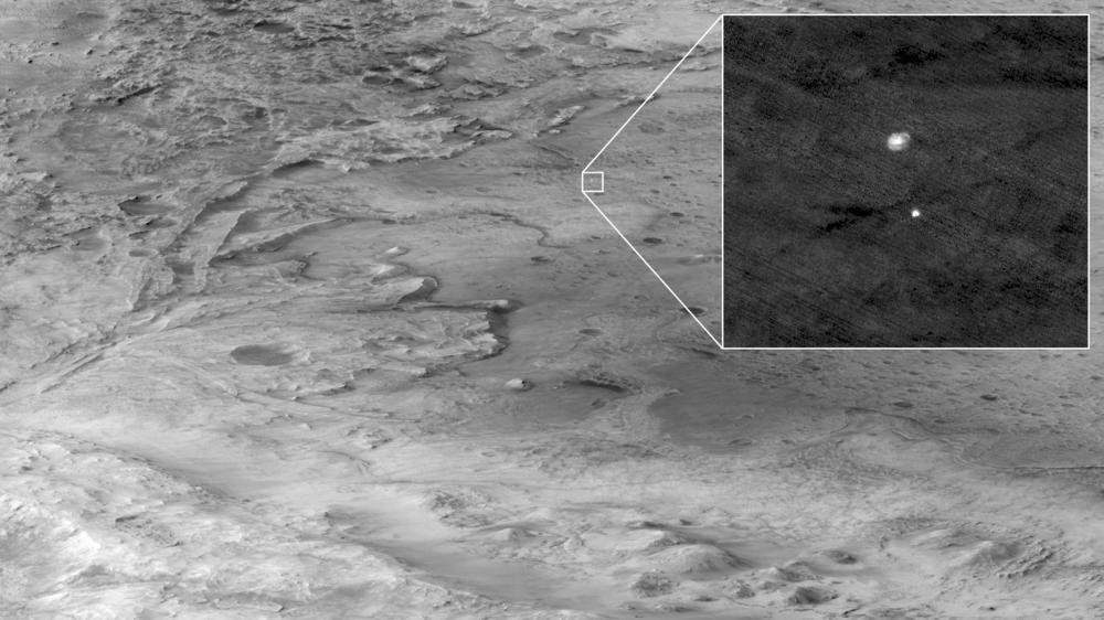 This image taken by the High Resolution Imaging Experiment (HiRISE) from NASA's Mars Reconnaissance Orbiter shows Perseverance descending to the planet's surface.