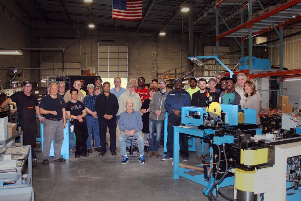 Lisa Winton, seen at far right with workers at Winton Machine in Suwanee, Ga., before the pandemic. She says her company is looking for more workers to meet a rush of orders.