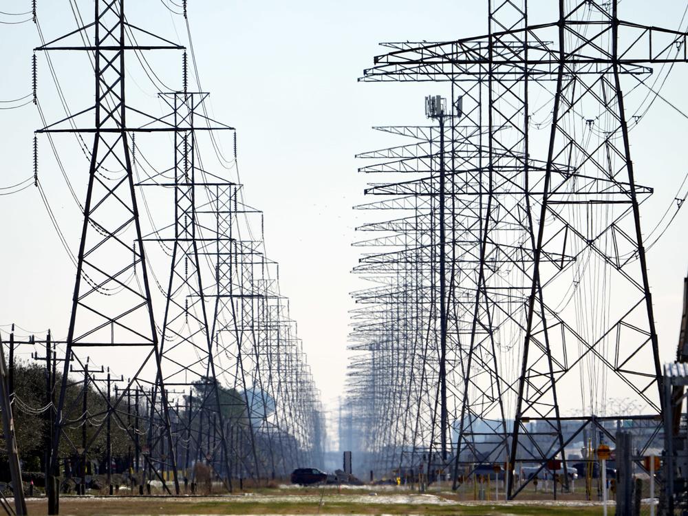 Power lines near Houston on Feb. 16. Some Texas residents are facing enormous power bills after wholesale prices for electricity skyrocketed amid last week's massive grid failure.