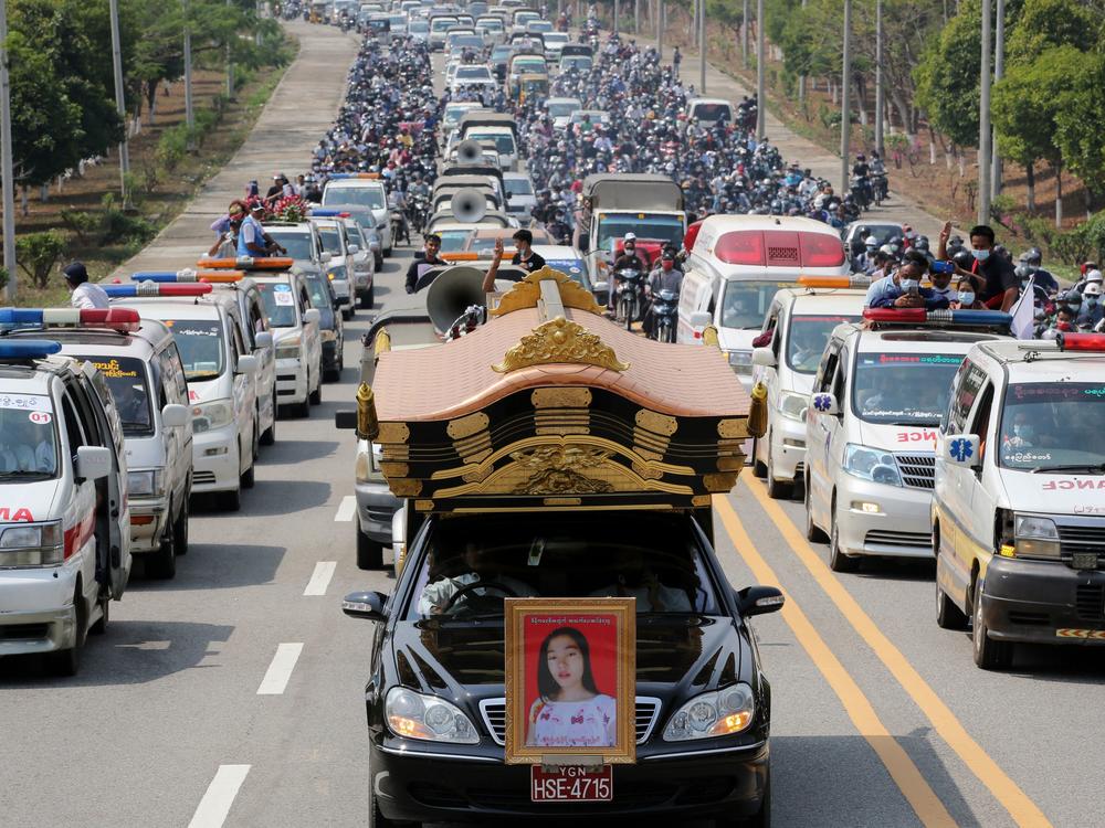 A car carrying the body of protester Mya Thwet Thwet Khine is pictured at the head of a convoy during her funeral service Sunday in Naypyitaw. She was the first confirmed fatality in the ongoing protests against the military coup.