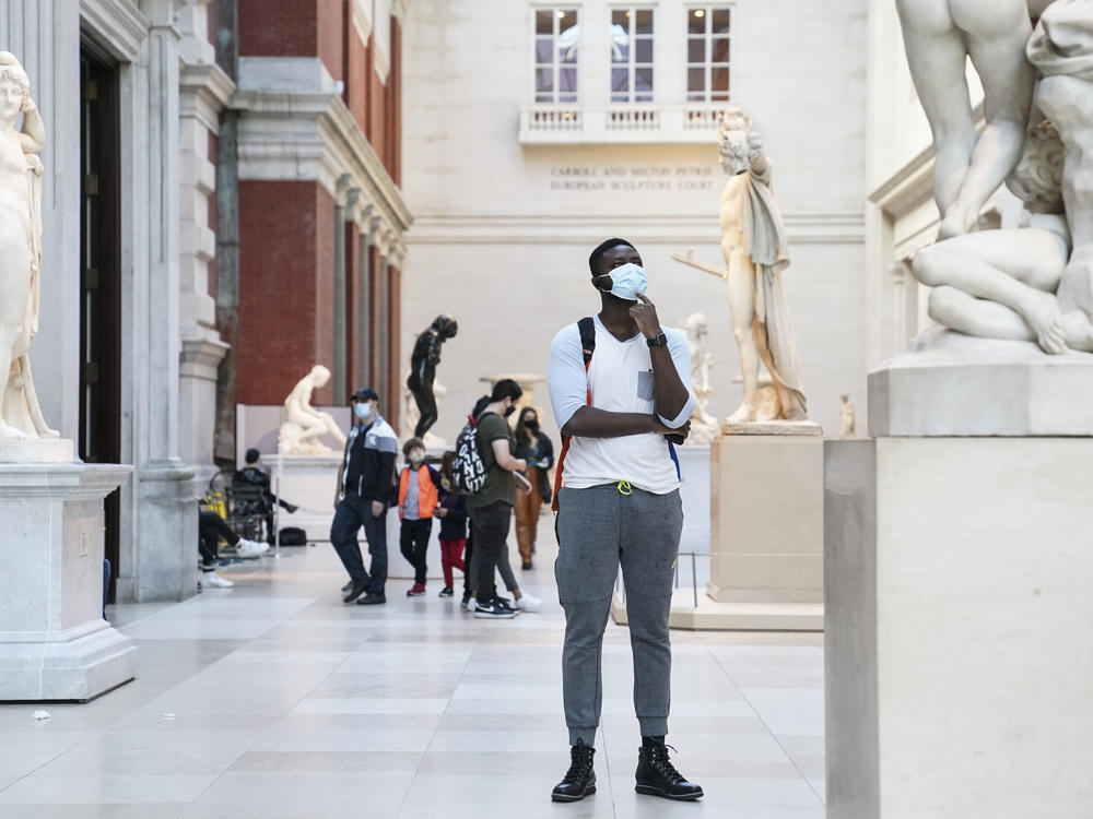 Visitors wear masks at the Metropolitan Museum of Art in October. The museum's director says the Met is considering selling art to pay for operating expenses.