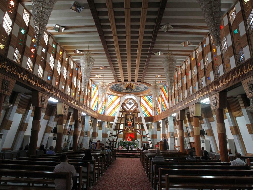 Iraqi Christians attend Mass at the Syriac Catholic church of Our Lady of Salvation, in Baghdad, on Oct. 30, 2016. Militants attacked the church in 2010.
