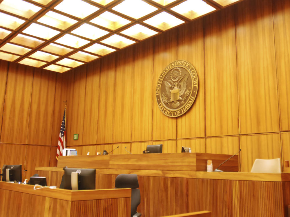 A U.S. federal courtroom sits empty in 2017 in Honolulu. A new study finds that judges with backgrounds as prosecutors or corporate lawyers are more likely to rule in favor of employers.
