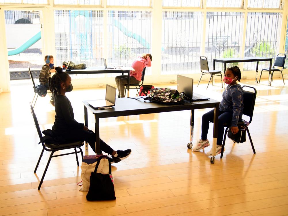 Children attend online classes at the Crenshaw Family YMCA in Los Angeles. Schools are having a hard time covering the costs required for in-person and online learning during the pandemic.