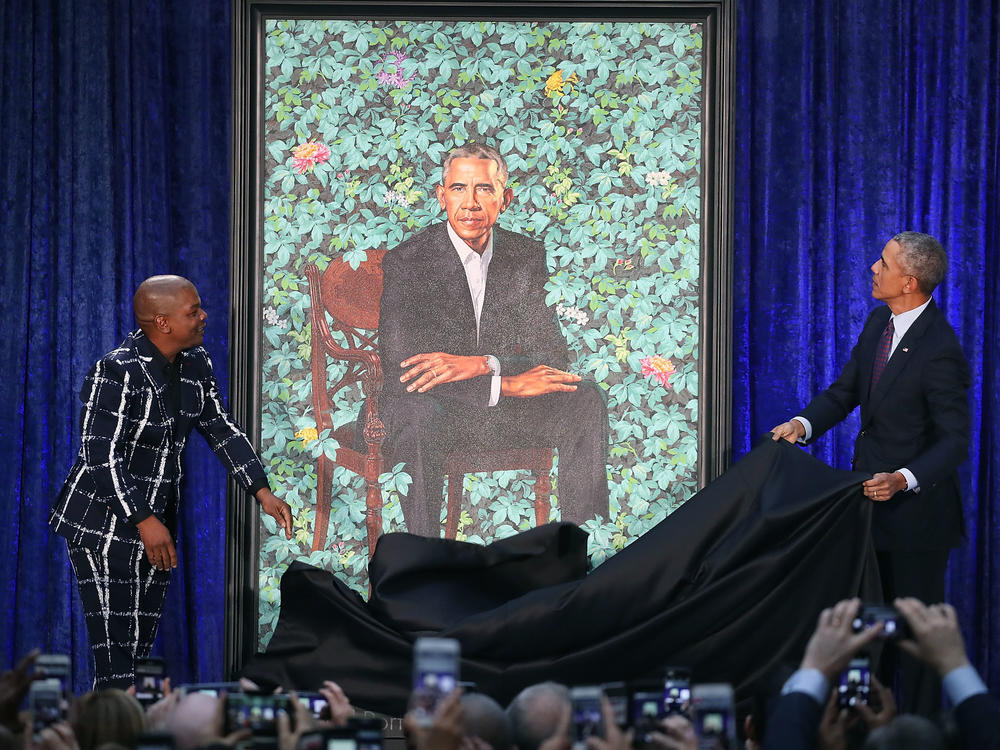 Artist Kehinde Wiley and former President Barack Obama unveil his portrait at the Smithsonian's National Portrait Gallery in Washington, D.C., in February 2018.