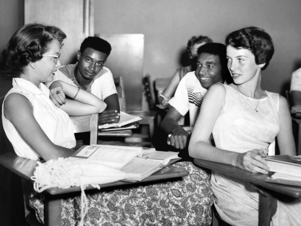 Students chat while waiting for history class to start at Oak Ridge High School in September of 1955, when the once all-white high school was desegregated by order of the Atomic Energy Commission. The Tennessee city's school board is now formally including the story of its integration in its curriculum.