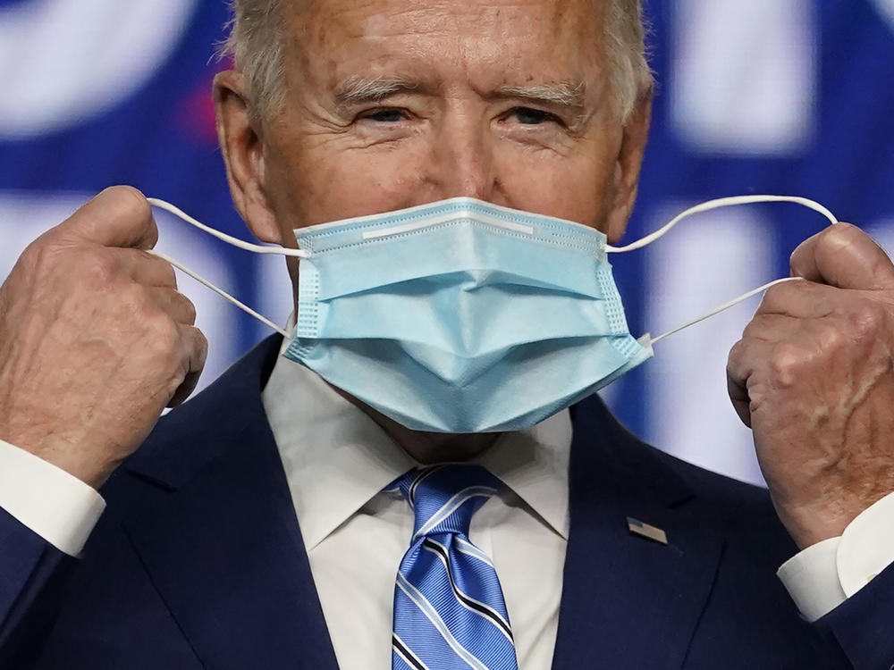President Joe Biden, pictured on the campaign trail in Nov. 2020, has long encouraged Americans to mask up in the fight against COVID-19. On Wednesday, his administration announced it will provide 25 million masks to community health centers and food banks across the country.