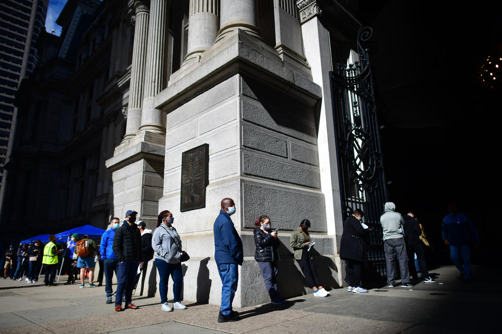 Voters queue outside Philadelphia City Hall to cast their early voting ballots on Oct. 27.
