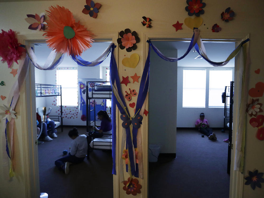 The Biden administration has reopened shelters for migrant teens that were first used by the Trump administration in Carrizo Springs, Texas. Long trailers that previously housed oil workers in two-bedroom suites were turned into dorms with bunk beds, classrooms and medical care.