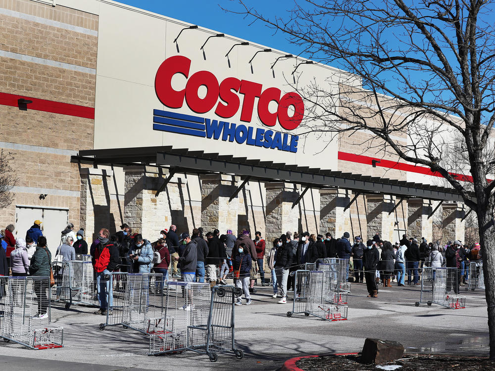 People wait to shop at a Costco in Texas on Feb. 20. Next week's pay increase would put Costco ahead of much of the industry.