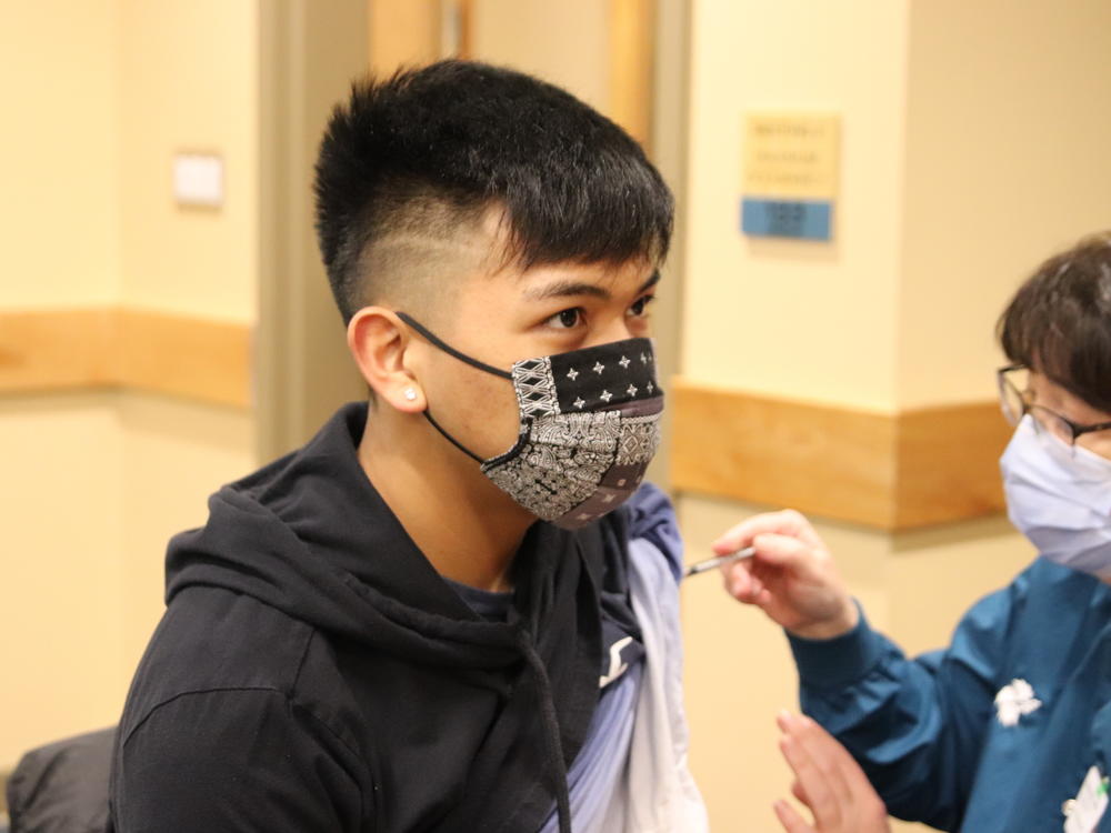 Seventeen-year-old Bradley Westlock receives his second COVID-19 vaccine shot. He and other teens in Sitka, Alaska, are eligible now that higher risk populations have already received the vaccination.