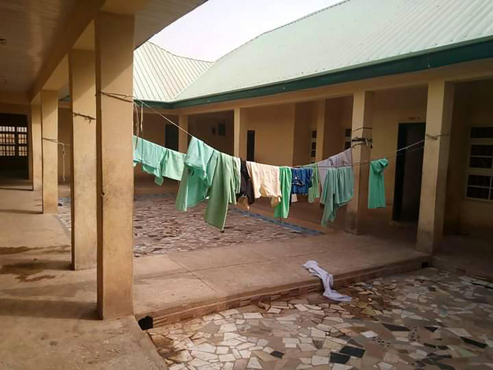 School uniforms hang in the deserted dormitory of the Government Girls Science Secondary School at Jangede, Zamfara State in northwest Nigeria, where more than 300 students were kidnapped by gunmen early Friday, local time.