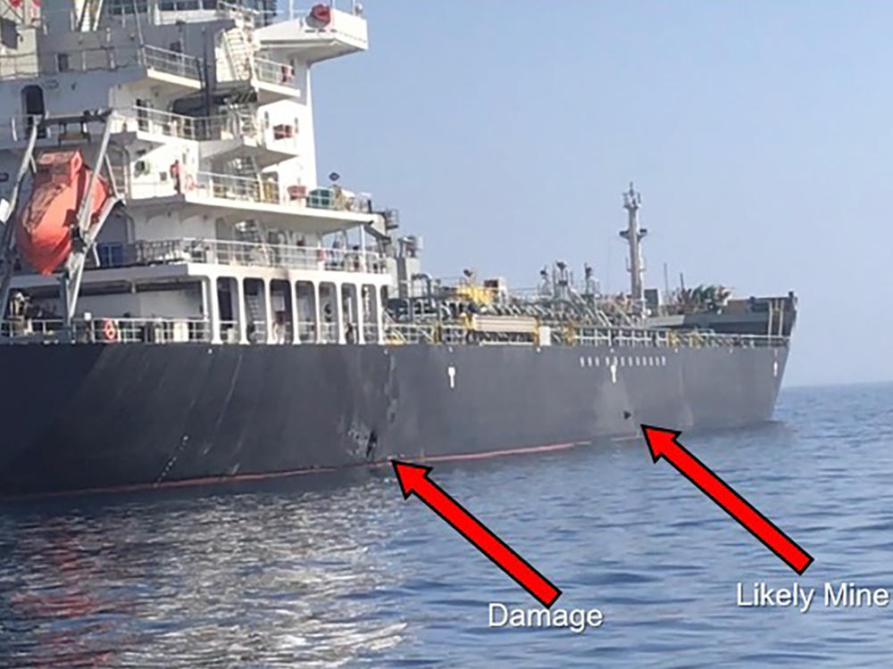 This June 2019 image released by U.S. Central Command, shows damage and a suspected mine on the MV Kokuka Courageous in the Gulf of Oman near the coast of Iran. The U.S. said Iranian forces were responsible.