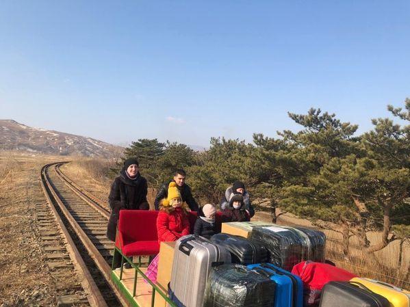 In this photo posted on the Russian Foreign Ministry Facebook page, Third Secretary Vladislav Sorokin of the Russian Embassy in North Korea pushes a handcart toward the North Korea-Russia border.
