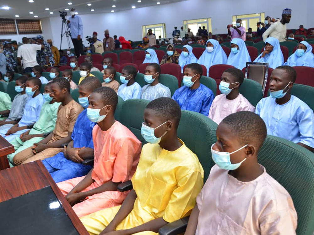 Abducted students of Government Science College Kagara sit in the state conference hall after being freed in Minna, Niger state, Nigeria, on Saturday.