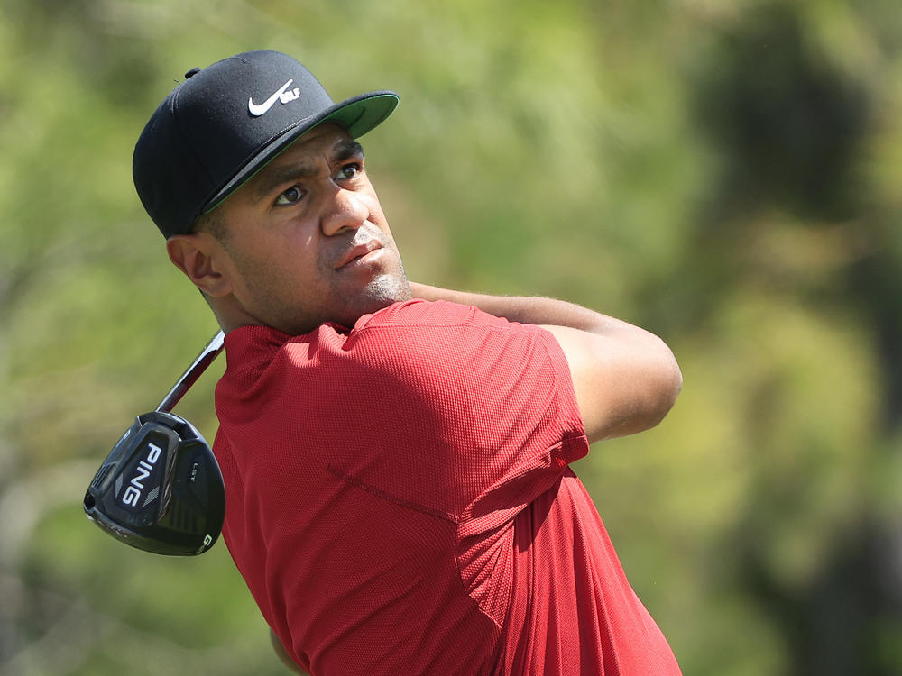 Tony Finau and other top golfers wore red in a tribute to Tiger Woods on Sunday, wishing him a full recovery from a dangerous car crash.