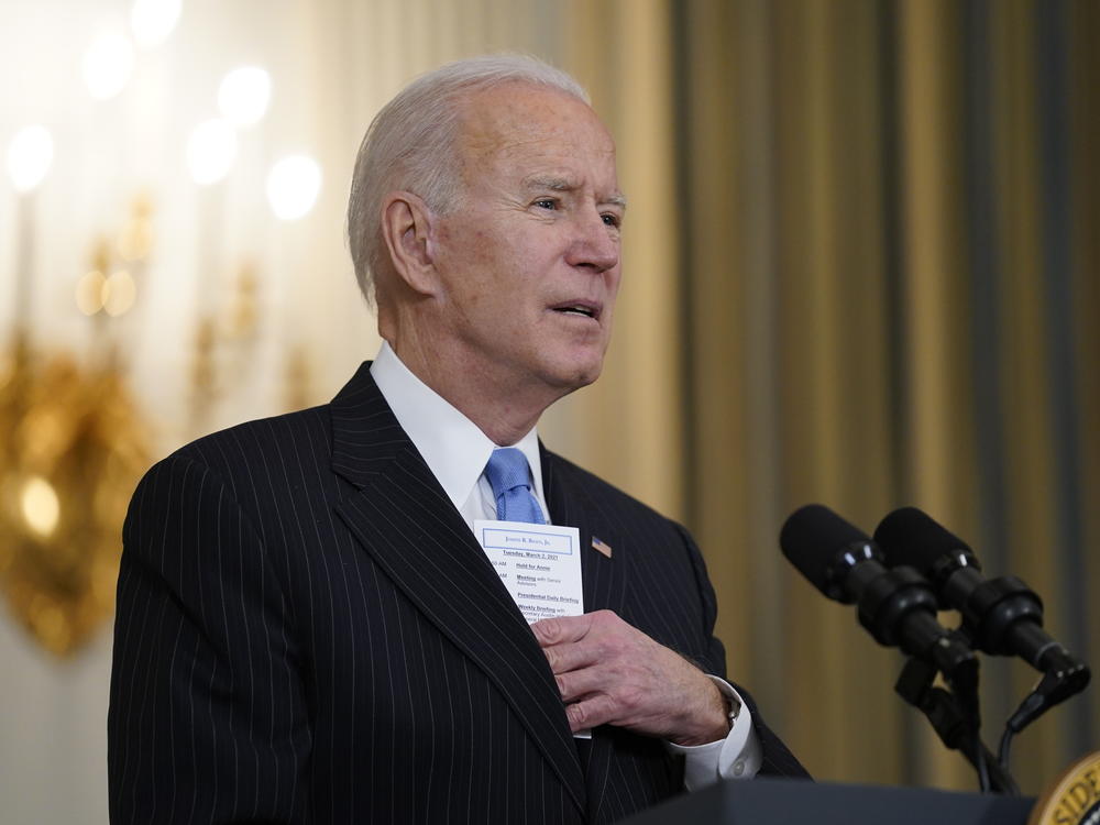 President Biden keeps a note card in his suit pocket with the running tally of how many Americans have died from COVID-19 and how many have been vaccinated.