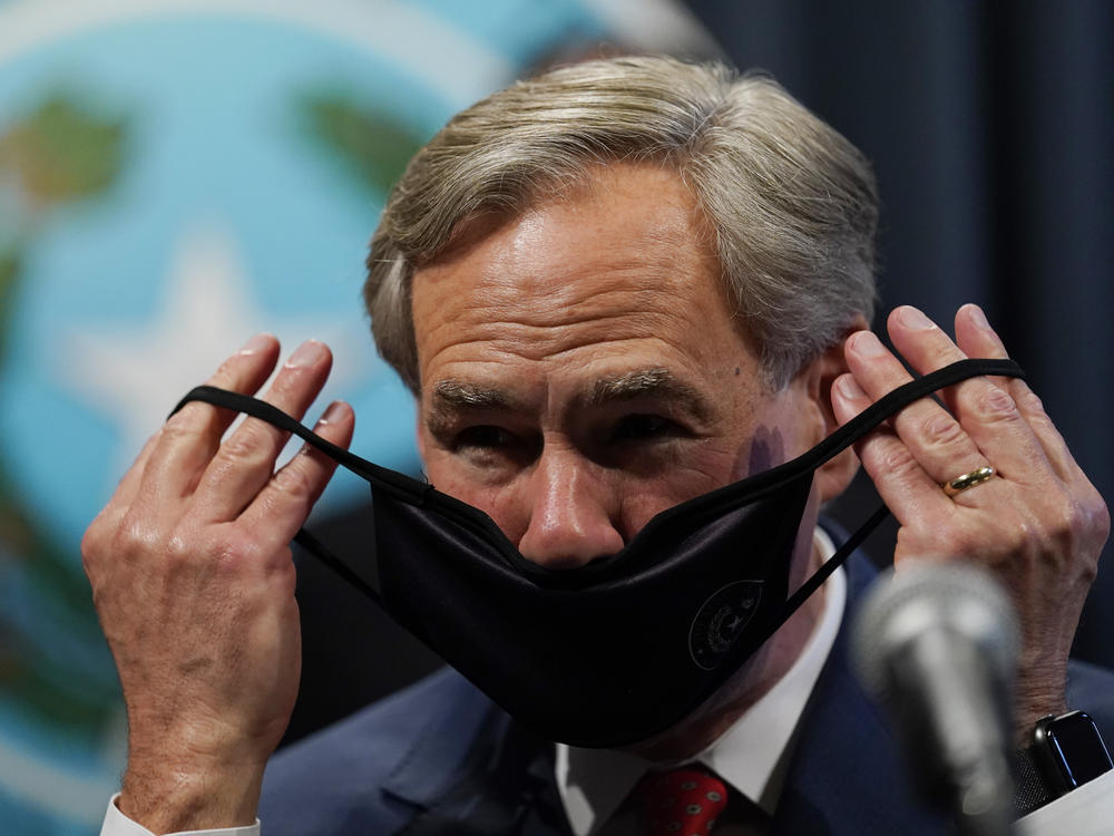Texas Gov. Greg Abbott, seen here donning a mask in September, announced Tuesday he will lift the state's mask mandate.
