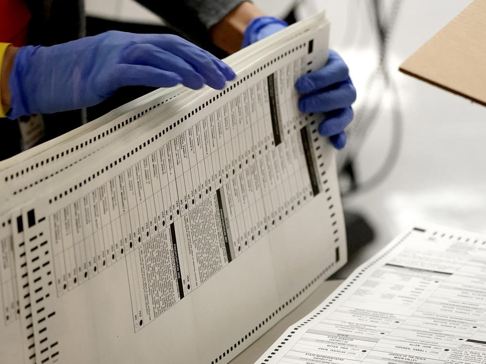 Eight years after carving the heart out of a landmark voting rights law, the Supreme Court heard arguments in a case that could put new limits on efforts to combat racial discrimination in voting.