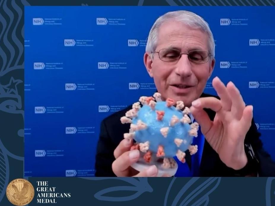 Dr. Anthony Fauci holds his personal 3D-printed model of the SARS-CoV-2 virion during the 