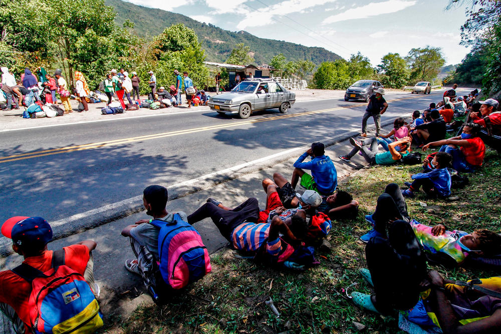 Venezuelan migrants rest as they wait to receive food and medicines from members of the Red Cross on a highway in Cucuta, Colombia, on the border with Venezuela last month.