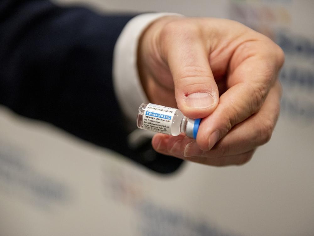 A health care worker holds a vial of the Johnson & Johnson COVID-19 vaccine at South Shore University Hospital in Bay Shore, N.Y., on Wednesday.