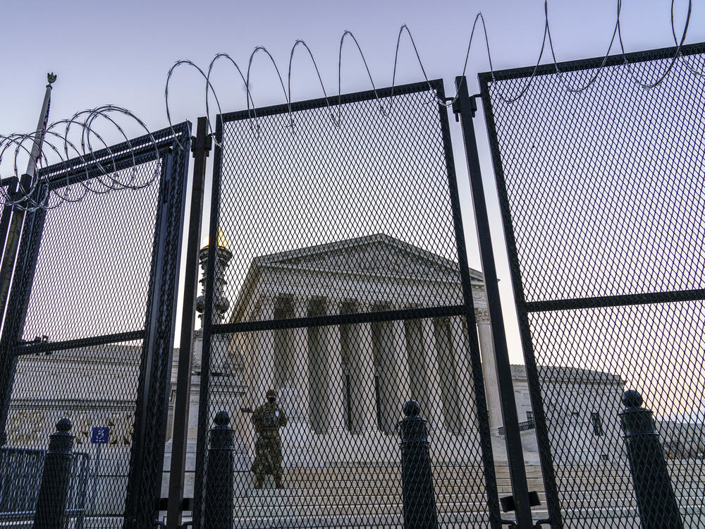 National Guard troops keep watch Thursday at the Supreme Court.