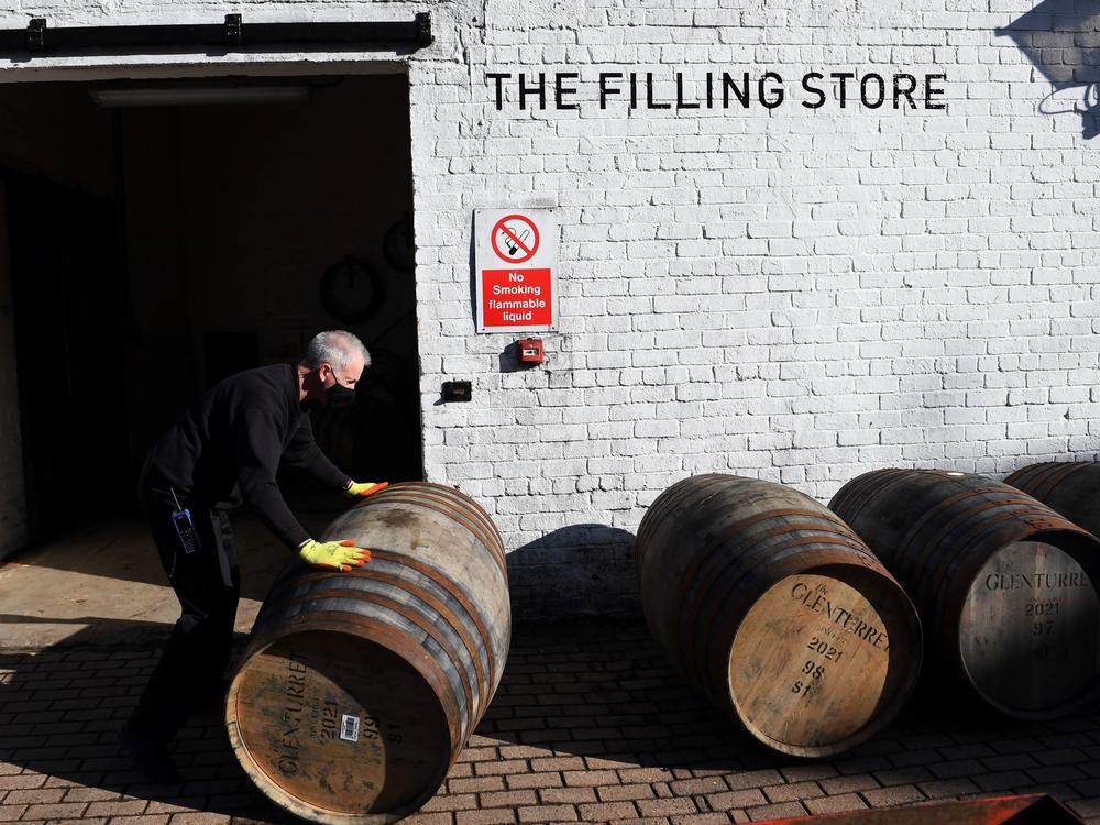 Scotch whisky producers are welcoming news of a breakthrough on tariffs, which came as the industry adjusted to both Brexit and then the COVID-19 pandemic. Here, an employee rolls a whisky barrel at the Glenturret Distillery in Crieff, central Scotland, last week.