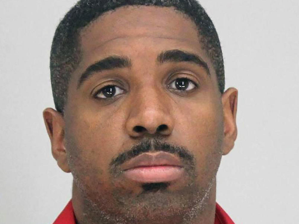 A photo provided by the Dallas County Sheriff's Office shows Bryan Riser. Authorities say Riser, a Dallas police officer, has been arrested on two counts of capital murder, more than a year and a half after a man told investigators that he kidnapped and killed two people at the officer's instruction in 2017.