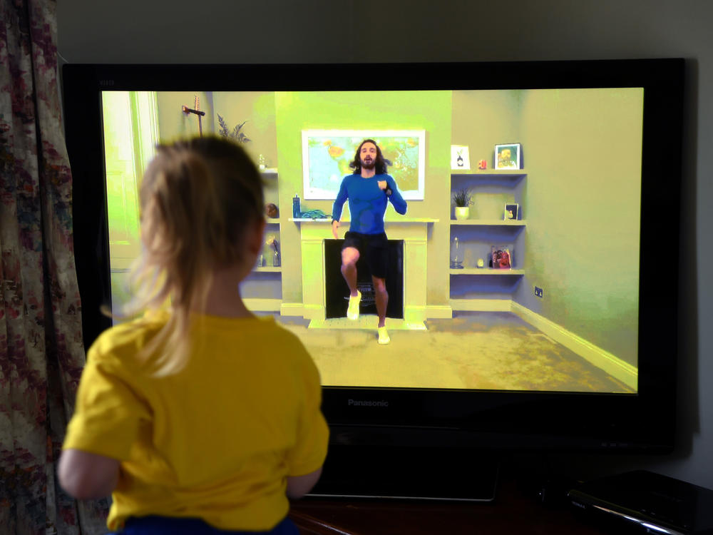 Four-year-old Lois Copley-Jones, the photographer's daughter, takes part in a livestreamed broadcast of 