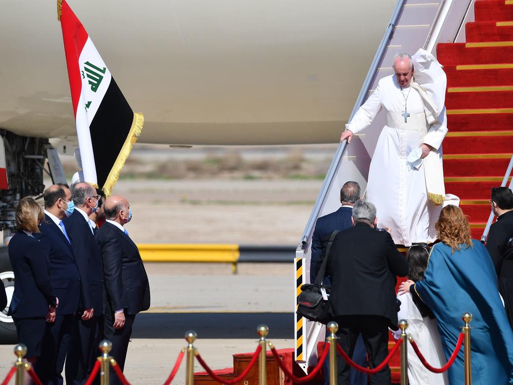 Pope Francis arrives at Baghdad International Airport on Friday for the first-ever papal visit to Iraq.
