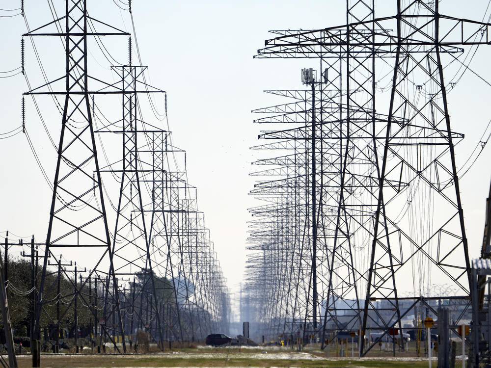 Power lines are seen on Feb. 16 in Houston. The Texas Public Utility Commission has declined to reverse $16 billion in charges from the worst of February's winter storm.