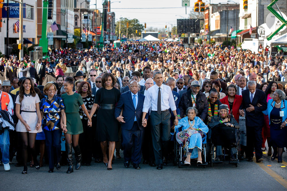 President Barack Obama, First Lady Michelle Obama and daughters Sasha and Malia and Rep. John Lewis prepare to walk across the Edmund Pettus Bridge to commemorate the 50th Anniversary of the Selma to Montgomery civil rights marches, in Selma, Alabama, March 7, 2015.
