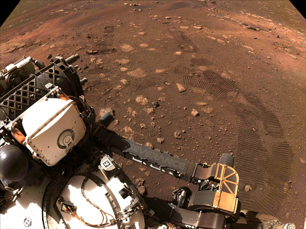 An image captured by the navigation cameras of NASA's Perseverance rover shows tracks on the surface of Mars during the rover's first test drive on March 4.