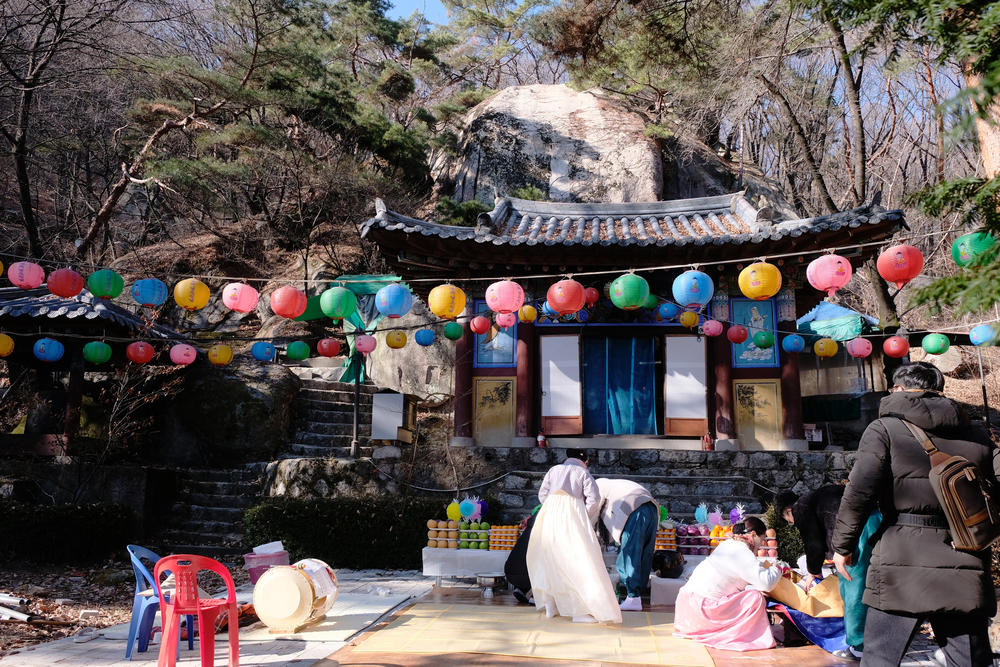 Participants clean up following a shamanic initiation ceremony at a temple in Seoul.