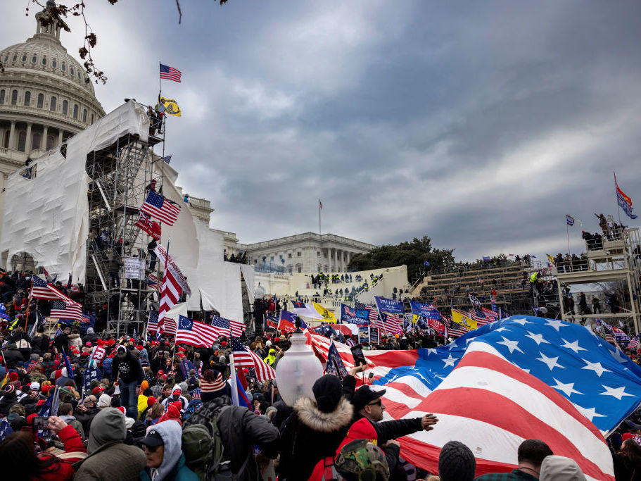 Rioters storm the Capitol on Jan. 6. Among those charged in connection with the insurrection are members of the paramilitary group the Oath Keepers.