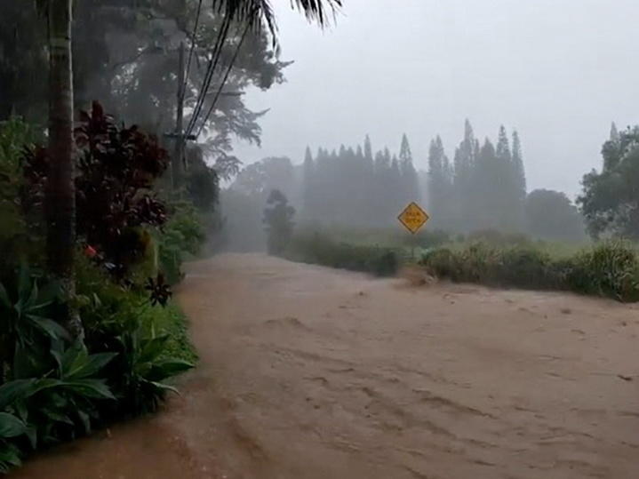 A road is flooded near the breached Kaupakalua Dam in the Haiku area of the Hawaiian island of Maui on Monday.