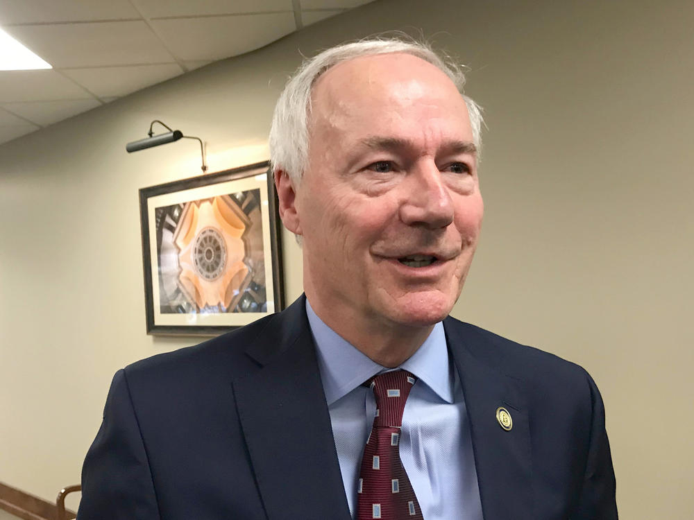 Arkansas Gov. Asa Hutchinson on Tuesday signed into law a bill banning nearly all abortions in the state, a sweeping measure that supporters hope will force the U.S. Supreme Court to revisit its landmark <em>Roe v. Wade</em> decision.