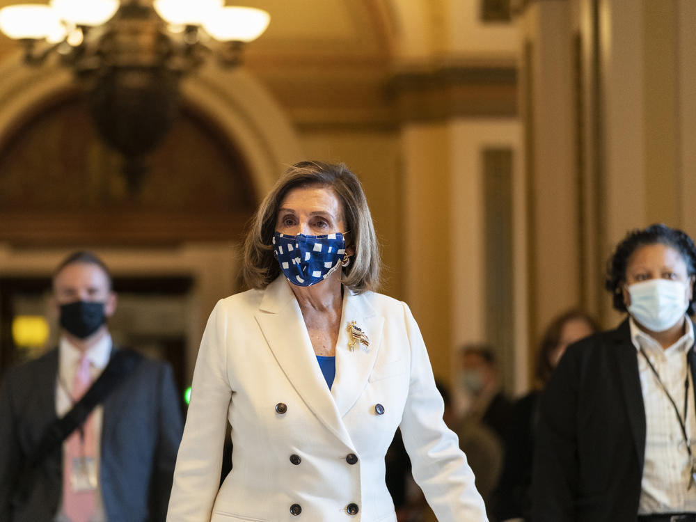 House Speaker Nancy Pelosi walks from the House floor during the vote on the $1.9 trillion COVID-19 relief bill Wednesday. Despite Republican criticism that the bill has provisions unrelated to the pandemic, Pelosi insists the bill is 