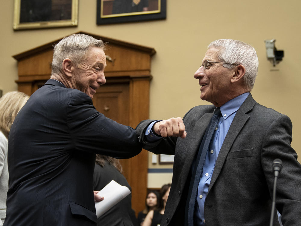 Before there were masks, there were elbow bumps. Rep. Stephen Lynch, D-Mass., and Dr. Anthony Fauci greet each other before a House Oversight and Reform Committee hearing on March 11, 2020.