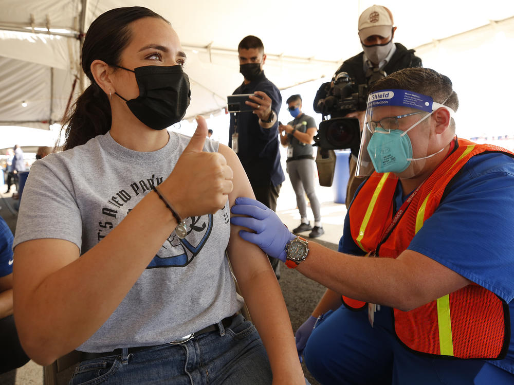 Miriam De La Torre receives a COVID-19 vaccine earlier this month. The LA Unified School District and the United Teachers LA union say they've reach a tentative agreement to return to in-person learning next month.