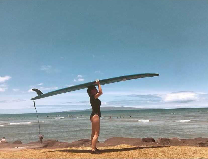 Kelsey took this photo of Audrey surfing in Hawaii in 2019. Kelsey moved back to the Bay Area after Audrey's death. She says she spends a lot of her time surfing and tries to leave her heartache on the shore.