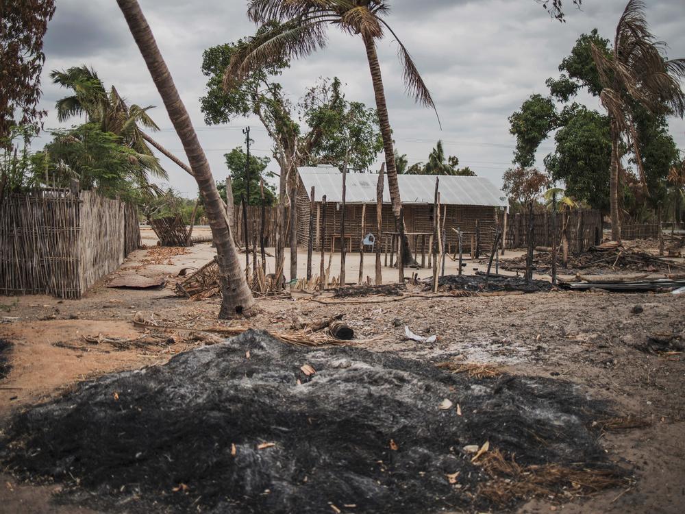 A mound of ashes is seen after an attack in the village of Aldeia da Paz outside Macomia, on Aug. 24, 2019. For the past three years, violence has devastated parts of northern Mozambique, leaving hundreds of thousands displaced.