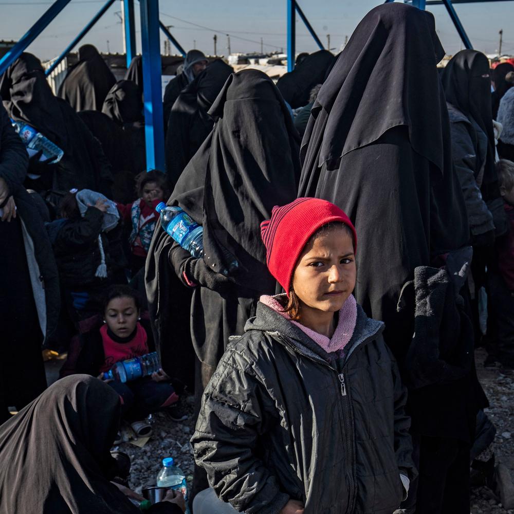 Syrians wait to leave the Kurdish-run al-Hol camp, which holds relatives of alleged Islamic State group fighters, in the Syrian northeastern al-Hasakeh governorate, in December.
