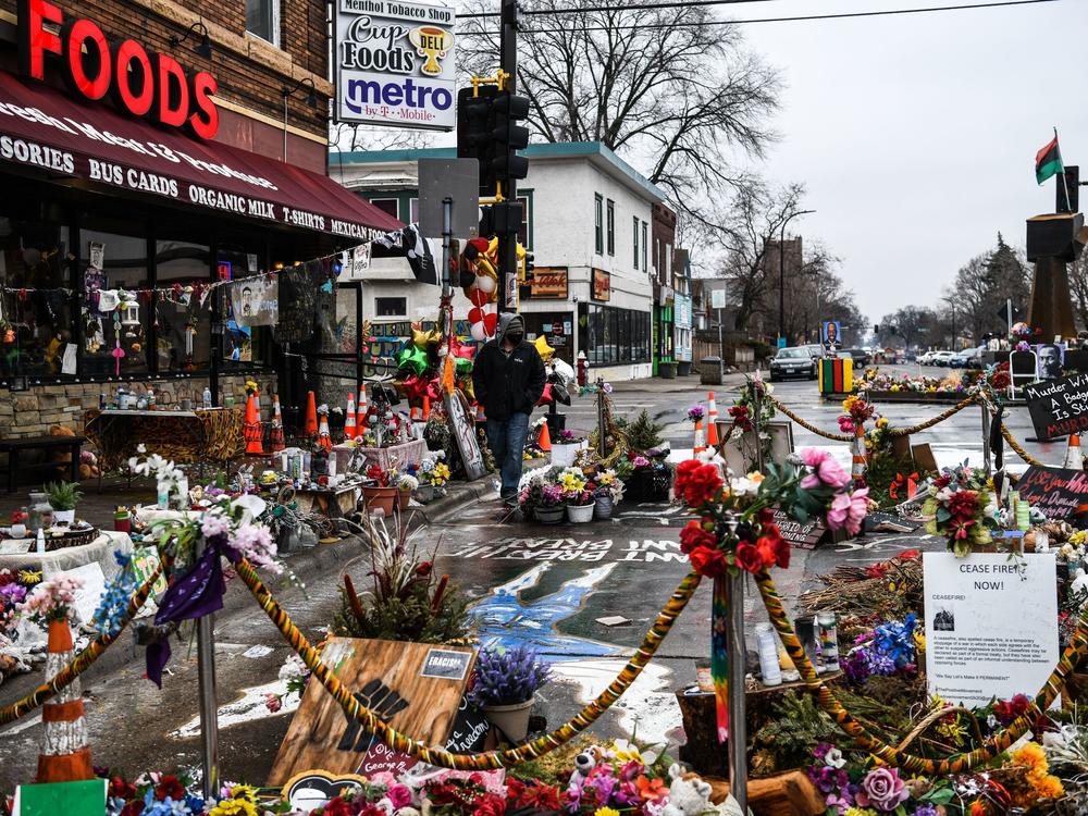 A makeshift memorial in Minneapolis honors George Floyd as jury selection begins in the trial of former police officer Derek Chauvin.